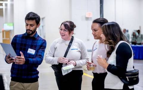 Students explain their projects to a guests at the GVSU Tech Week Event